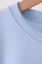 Blue football sequin mom&me top