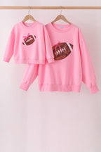 Pink football sequin mom&me top