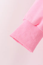 Pink football sequin mom&me top