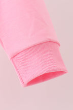Pink football sequin mom&me top
