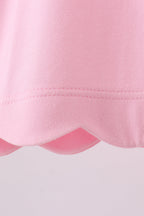 Pink flutter sleeve scalloped top