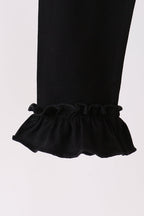 Black ruffle pants