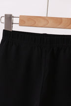 Black ruffle pants