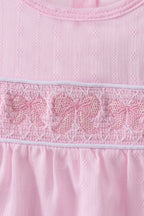 Pink bow smocked ruffle bubble