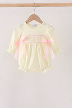 Cream smocked bow bubble