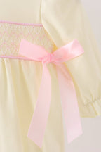 Cream smocked bow bubble