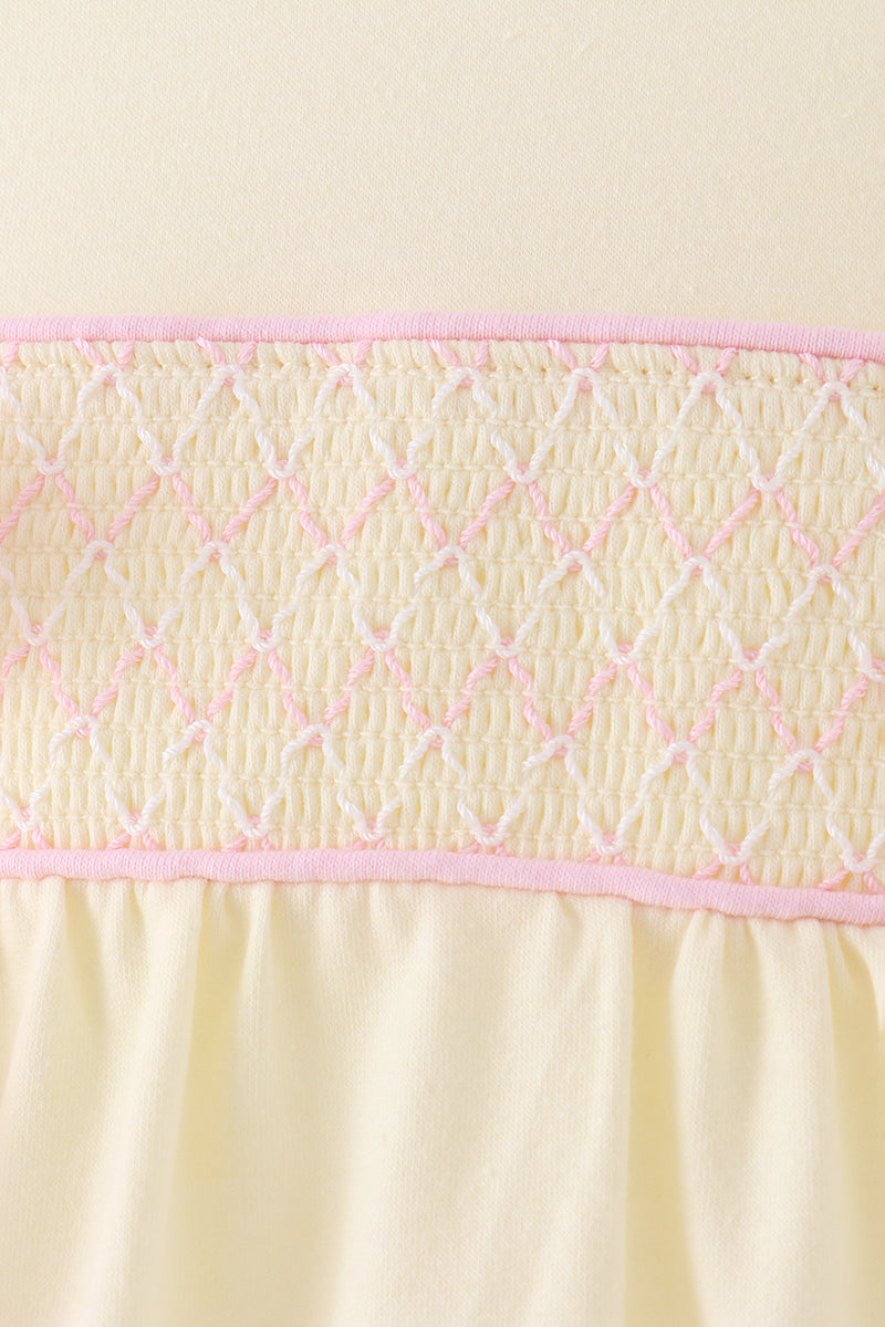 Cream smocked bow bubble