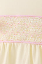 Cream smocked bow bubble
