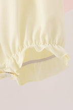 Cream smocked bow bubble