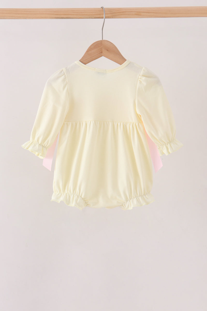 Cream smocked bow bubble