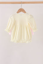 Cream smocked bow bubble