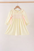 Cream smocked bow dress
