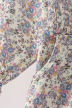 Blue floral smocked jumpsuit