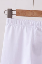 White ruffle pants